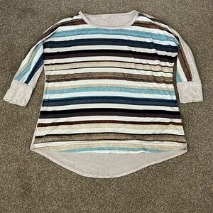Women’s 3/4 sleeve tunic top. Tan with multi stripes in front while tan in back.